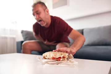 Man having food poisoning and nausea.