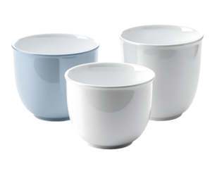 Three cylindrical ceramic cups; one white, one light blue, one larger white.  Smooth, glossy finish