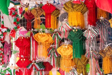 The image showcases a vibrant and lively display of handcrafted items, arranged in a way that draws...