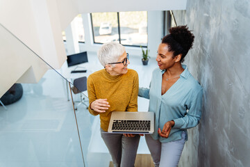 Mixed team of software engineers brainstorming ideas. Diverse app developers collaborating as group