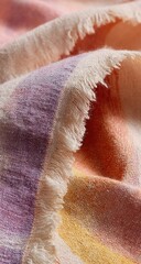 Fototapeta premium Close-up of a textured blanket with pastel colors and fringe