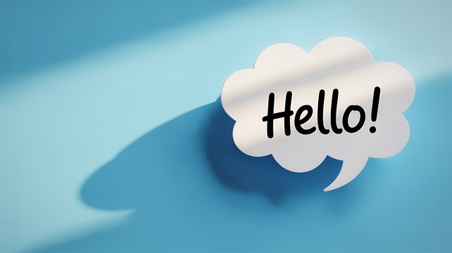 A white paper speech bubble with the word hello written in black ink casting a shadow on a blue background
