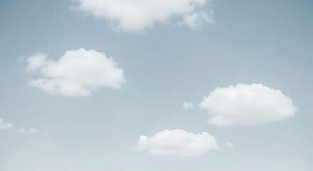 Fototapeta premium Soft white cumulus clouds floating gently in a pale blue sky on a clear day