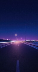 A long, straight road vanishes into a starlit, purple-hued night.  Streetlights illuminate the asphalt, creating light trails