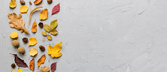 Autumn composition. Pattern made of dried leaves and other design accessories on table. Flat lay,...