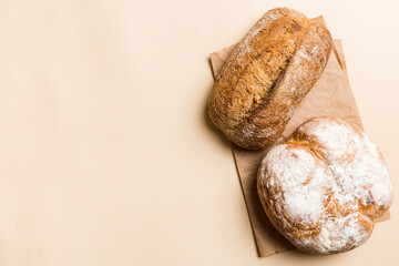 Homemade natural breads. Different kinds of fresh bread as background, top view with copy space