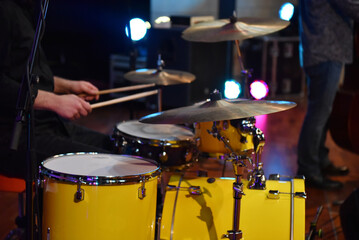 Drummer playing live on stage at blues concert