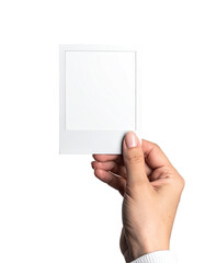 A hand holds a blank instant photo frame (1)