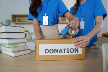 Donation Packaging. Volunteers preparing boxes for community donations.