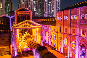 Factory buildings and industrial equipment in the evening