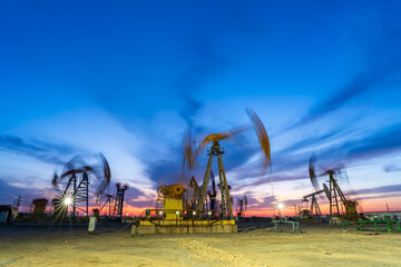 In the evening of oilfield derrick