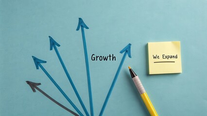 Arrows Indicating Growth with Sticky Note and Pen on Blue Background