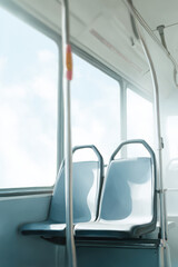 minimalist interior showcasing bus schedule with ar times displayed through blurred white text bars