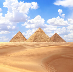 Famous Great Pyramids of Menkaure, Chephren and Cheops, Cairo, Egypt. Three iconic Great Pyramids and beautiful sand dunes, Giza Necropolis, have become a popular destination for travellers
