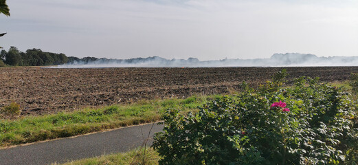 Burning off a Danish agricultural field after harvest with a controlled fire