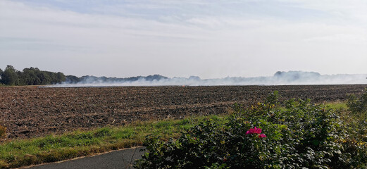 Burning off a Danish agricultural field after harvest with a controlled fire