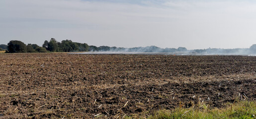 Burning off a Danish agricultural field after harvest with a controlled fire