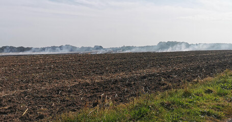 Burning off a Danish agricultural field after harvest with a controlled fire