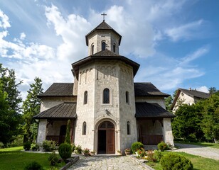 Exterior of a stone church with a dark-shingled roof under a cloudy sky