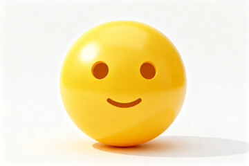 Fototapeta premium A yellow spherical object with a simple smiling face design, featuring two circular eyes and a curved mouth, set against a plain white background.