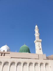 Obraz premium Madina, Saudi Arabia. Aerial view of Masjidil Nabawi at Madinah Al Munawwarah with blurred background. Architecture photography concept design. Prophet Rasul Muhammad SAW Masjid.