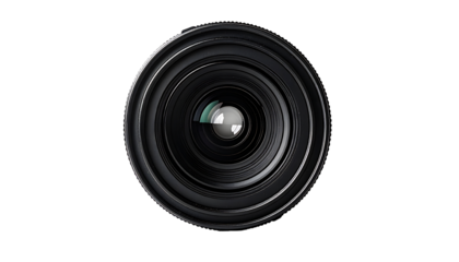 A close-up reveals a black camera lens, circular with concentric rings, showcasing its intricate internal structure and gleaming central element against a stark black background