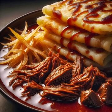 A traditional Malaysian dish called Pek Nga or Lempeng Kelapa which is a shredded coconut crepe eaten with beef curry. 