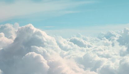 Fototapeta premium High-altitude view of puffy white clouds against a light blue sky