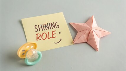 Creative Desk Arrangement with Pacifier, Paper Star, and Note