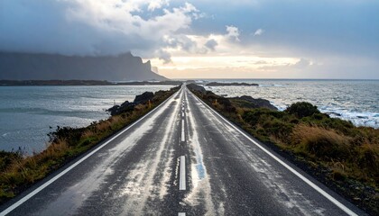 Rain swept coastal road reflective sheen faint horizon glow minimal traces representing quiet seascape transit and moody weather suitable for travel guides safety messaging