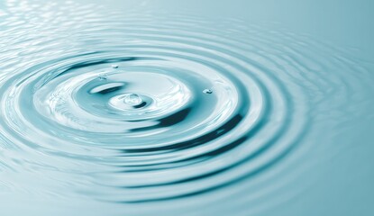 Light blue water ripples from a drop impact