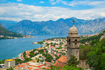 Scenic view of the Bay of Kotor in Montenegro with an old church tower in the foreground.