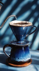 Pourover coffee brewing with gooseneck kettle in rustic kitchen