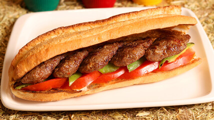 Delicious meatball sandwich in bread, close up