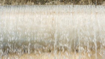 Wall of falling water as background