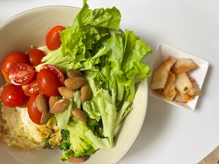 Fresh vegetable salad with a vibrant mix of greens, cherry tomatoes, cucumbers, and bell peppers. Crisp, colorful, and packed with vitamins, this salad makes a healthy, delicious meal or side.
