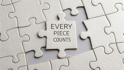 Obraz premium Every Piece Counts - Puzzle Piece with Inspirational Text Focused