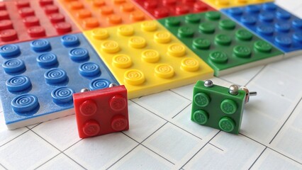Fototapeta premium Brightly colored lego brick studs arranged on a flat surface create an engaging visual for creative projects and play