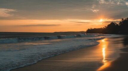 Golden Hour Serenity: A breathtaking coastal scene unfolds as the sun dips below the horizon, painting the sky and sea with warm, golden hues. The waves gently lap the shore.