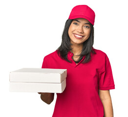 Latina delivering pizza, studio setup happy, smiling and cheerful.