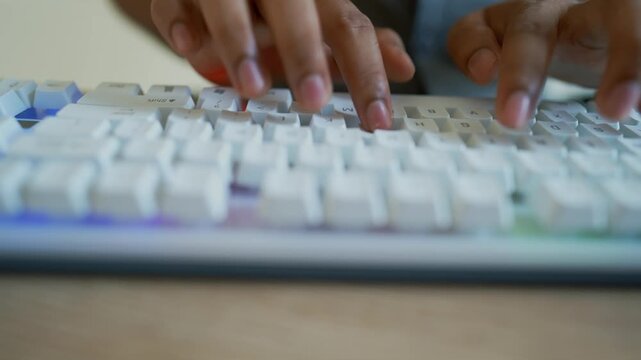 Typing on White Mechanical Keyboard with Blue Backlight, Office Worker Typing on Desktop Keyboard at Modern Office Desk