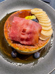 Savory delight: pancakes with ham and fruits