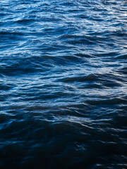 Deep Blue Ocean Water Waves Surface with Silver Light Reflection - Abstract Sea Texture Background Pattern