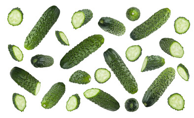 Green cucumbers pattern, isolated. Mix of fresh green cucumbers - whole, half, round slices from different sides flying on white background. Great for farm-fresh organic produce, culinary advertising.