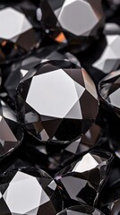 Shimmering black diamonds scattered on a dark surface phone wallpaper