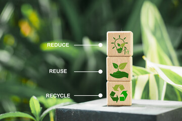 wooden cube block with reduce, reuse and recycle symbol with blurred green nature background for save world, environmental concept