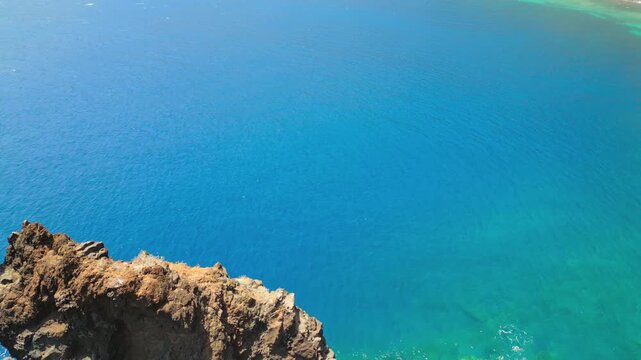 Drone footage near Roque de Bonanza, one of the symbols of El Hierro island and its natives. Huge Rock sticking out of the water on the las Almorranas beach. El Hierro, Canary islands, Spain	