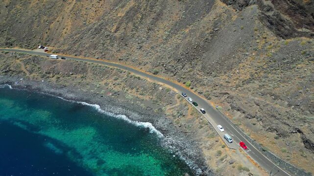 Drone footage near Roque de Bonanza, one of the symbols of El Hierro island and its natives. Huge Rock sticking out of the water on the las Almorranas beach. El Hierro, Canary islands, Spain	