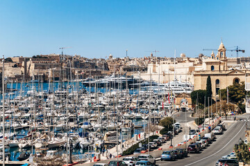 Birgu, Malta &ndash; April 11, 2025: Panoramic view of the Grand Harbour Marina, with moored yachts, traditional limestone buildings between Birgu (Vittoriosa) and and Senglea (Isla)