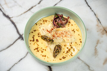 A top-down view of savory mushroom crepes in a creamy sauce.